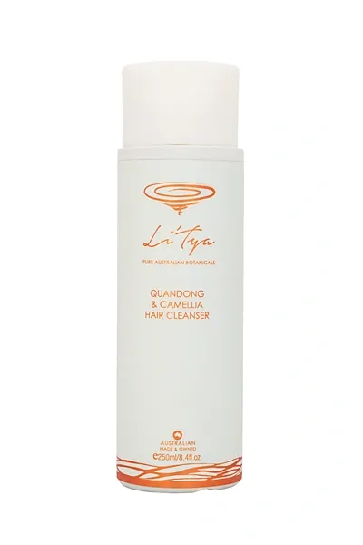 A bottle of face cleanser with orange label.