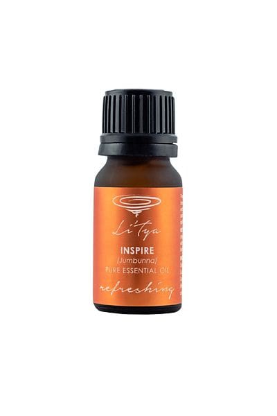 A bottle of essential oil with the label inspire